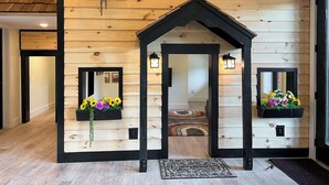 A wooden interior with a central door, black-framed windows, and flower boxes. - Incredible Views *Arcade*Cinema*Sauna*Steamroom @ Peachtree Ridge (Boone)