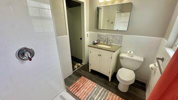 Shower, towels, soap, toilet paper