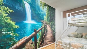 A room with a bunk bed, a mural of a waterfall, and a wooden pathway. - Villa 'Oasis D Sol I-Private Pool' with Sea Views, Wi-Fi and Air Conditioning (Urbanización Cerro Garbancito)