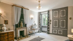 A bedroom with a bed, dresser, vanity, and a fireplace. - Marie-Antoinette Room, Character Suite, 40 m² with Private Lounge (Saint-Albin-de-Vaulserre)