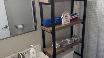 Shower, towels, soap, toilet paper