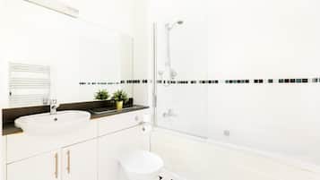 Shower, hair dryer, towels, shampoo