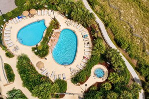 An aerial view of a resort with two swimming pools, sun loungers, and a hot tub. - 9th-Floor Ocean View Condo, Pool & Hot Tub (Myrtle Beach)