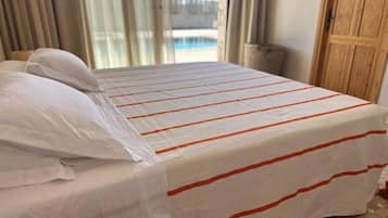 Comfort Room, Patio, Pool View | Soundproofing, iron/ironing board, free WiFi, wheelchair access