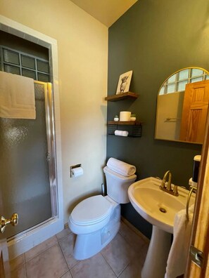 A bathroom with a shower, toilet, sink, and a mirror. - Biggest Twin Lakes lodge room, sleeps 4 - private bath, entrance & lake views (Twin Lakes)