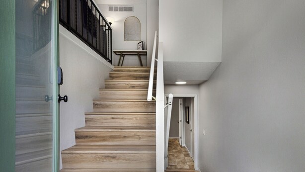 A staircase with wooden steps and white walls. - Rad Pad - Arcades, Seasonal Pool (Boise)