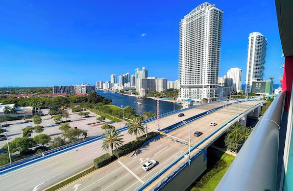 A cityscape with high-rise buildings, a river, and a bridge. - Relaxing Studio w/ Bay & Marina View (Hallandale Beach)