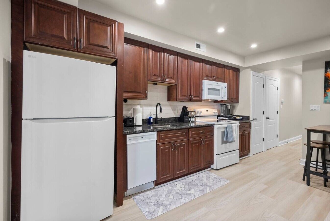 Coffee/tea maker, fridge, microwave, oven