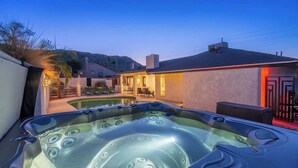 A hot tub in a backyard with a pool, a house, and a mountain in the background. - Mountain Retreat+Golf+Poker+DivingPool+Spa+GmeRm (Phoenix)