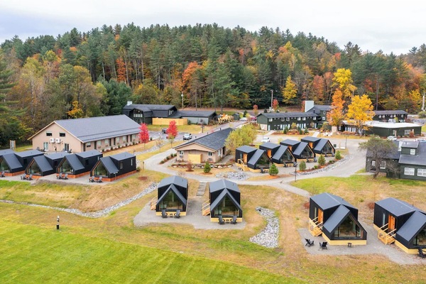 Explore the expansive retreat layout nestled among autumn woods.