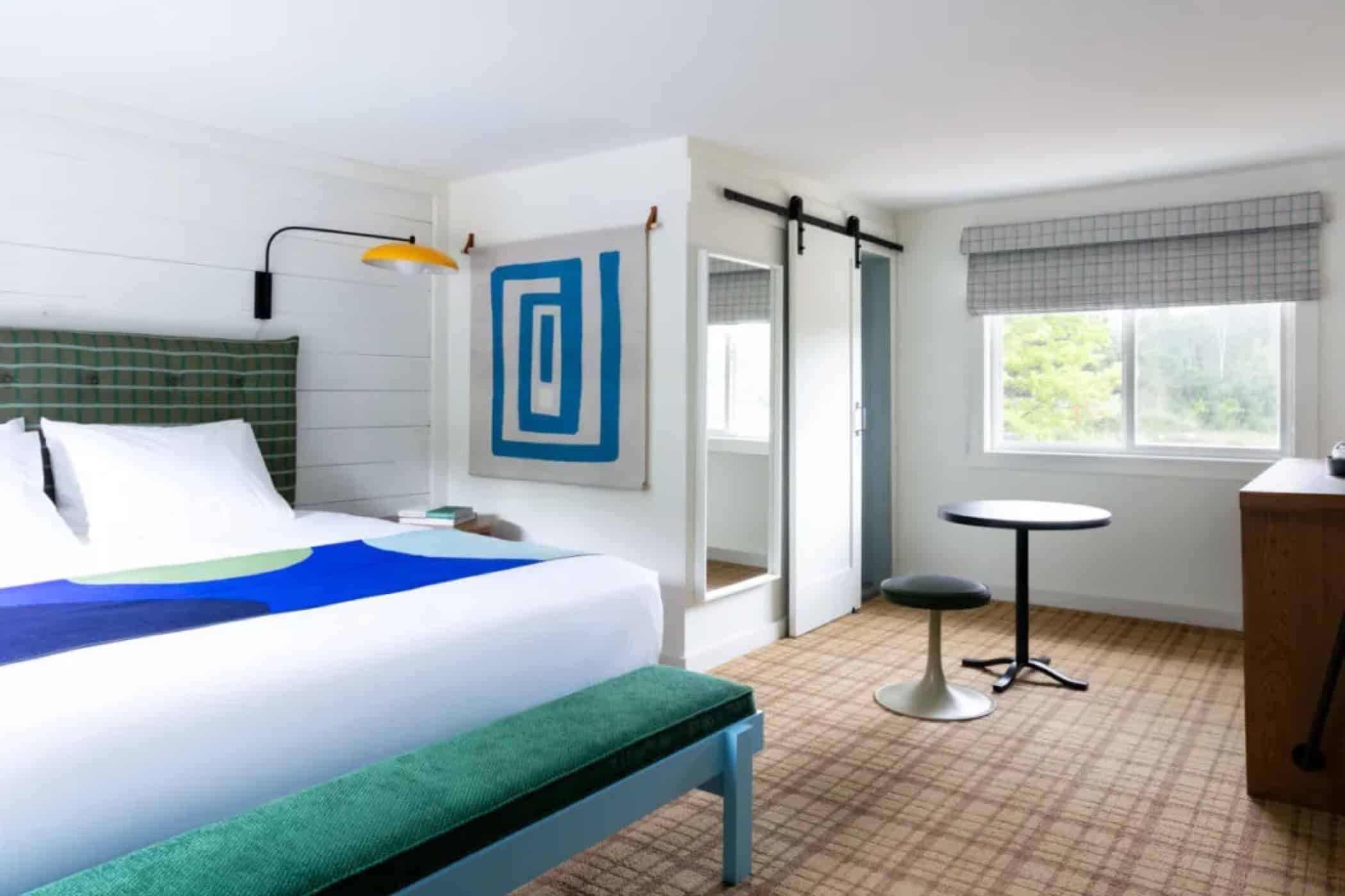 Spread out in a spacious room with table and natural light.