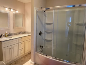 Shower, jetted bath, towels, soap