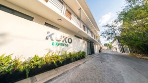 A modern building with a sign reading 'KUKO EXPRESS' on the facade.