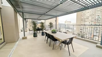 Apartamento | Restaurante al aire libre