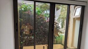A bathroom with a window, a sink, and a mirror. - Pool View Apartment at 'Domaine dès Alizées Club & Spa' (Grand Baie)