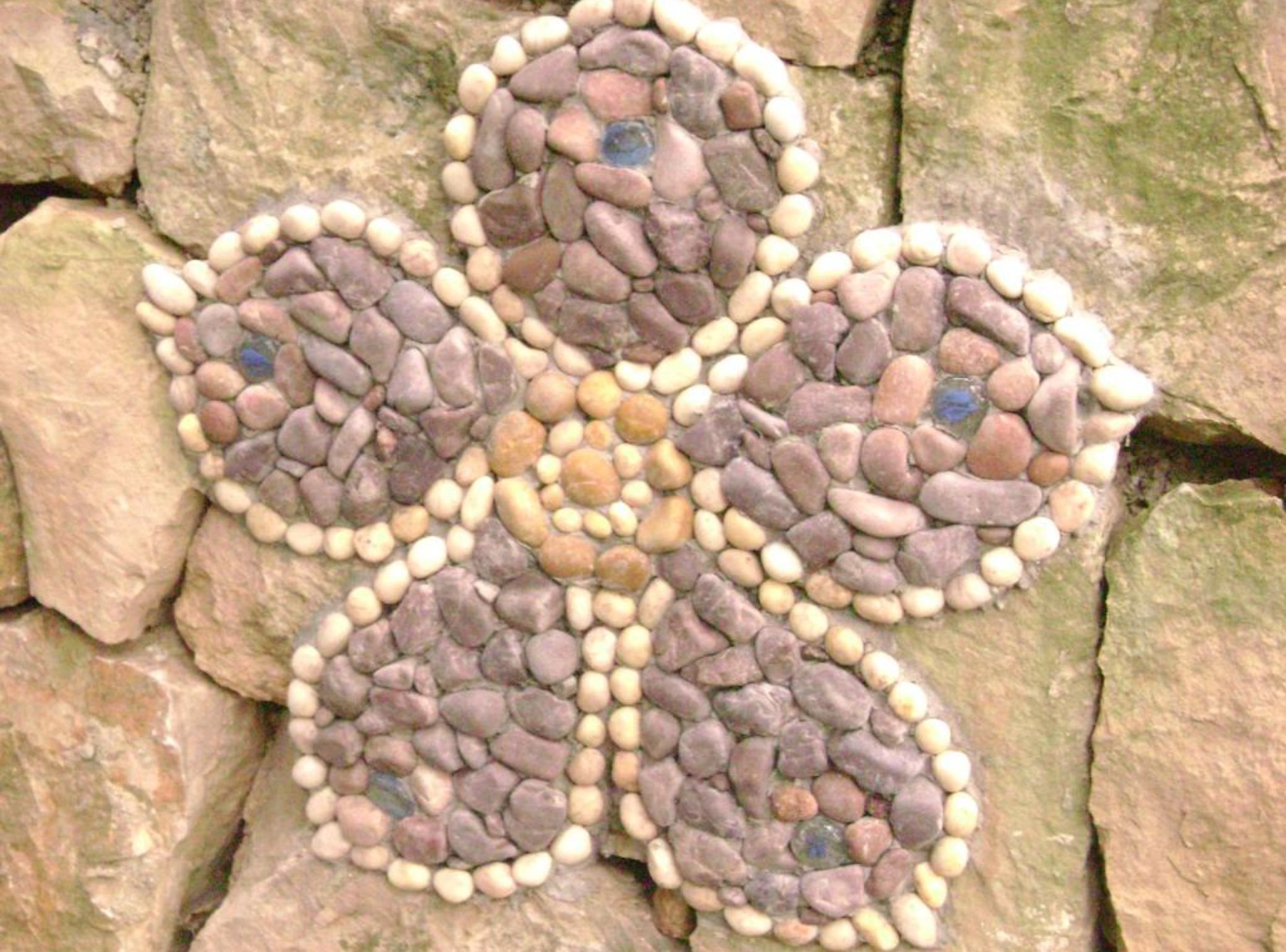 A stone wall with a geometric pattern of stones.