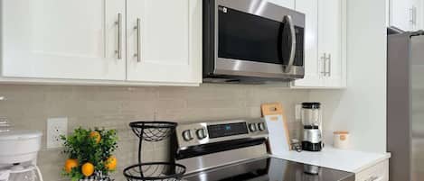 Coffee/tea maker, fridge, microwave, oven
