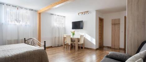 Apartment, Garden View | In-room safe, blackout drapes, soundproofing, iron/ironing board