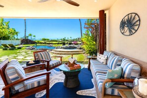The lanai features comfortable, shaded seating, perfect for relaxing after spending the day by the pool - One Ocean Estates Luxury Ocean View 3 BR | Car Incl. w/ 6+ Nights | OOE-2A by KBM (Kamuela)