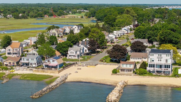 A coastal residential area with houses, a beach, and a waterway. - NEW Twin Tides Retreat-steps to private beach. Two Homes, One Memorable Stay (Clinton)