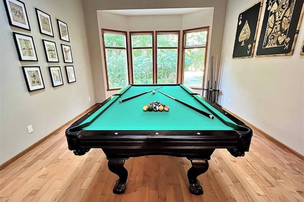 Professional Princeton 8ft billiard table. The room is outfitted with unique décor to set the ambiance.