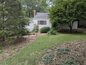 A house with a front yard, a small garden, and a tree. - 3BR Decatur Home - Avondale Train to Stadium/Downtown (Decatur)