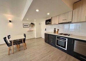 Coffee/tea maker, fridge, microwave, oven