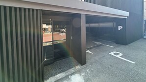 A modern building with a sign reading 'LANTANA HOTEL' and a parking area with marked spaces. - Gwangju Hotel Lantana - Hanam (Gwangju)
