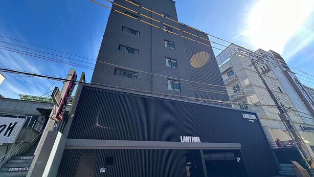 A modern building with a prominent 'LANTANA' sign, featuring a large entrance and a visible staircase. - Gwangju Hotel Lantana - Hanam (Gwangju)