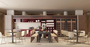 A modern library with a central table and chairs, surrounded by bookshelves. - Go Hotel Chiang Rai (Chiang Rai)