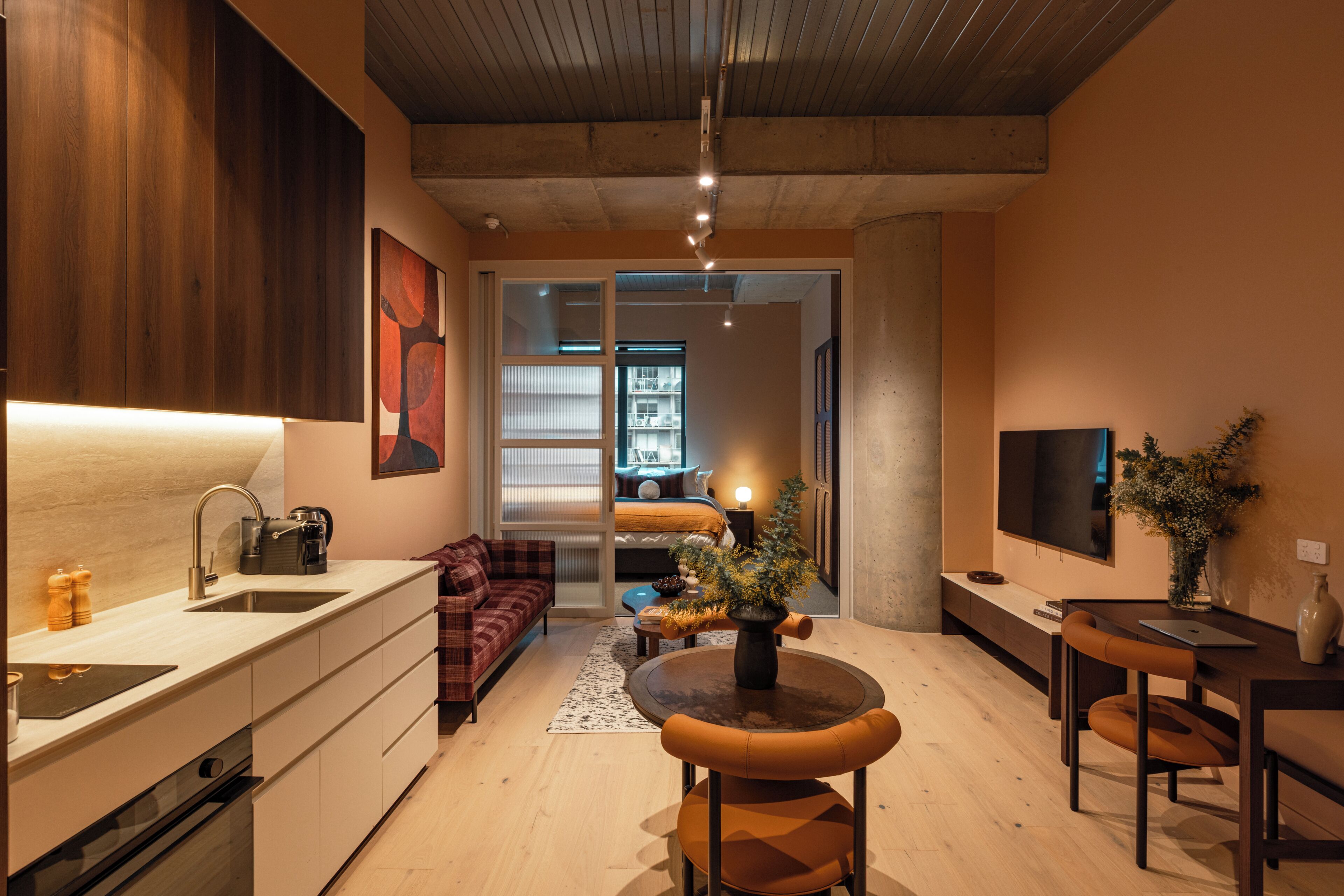 A modern interior with a kitchen, dining area, and living space.