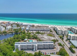 A coastal hotel with multiple buildings, a beach, and a pool area. - Beautiful 2 bedroom/2 bath condo in Santa Rosa Beach (Santa Rosa Beach)