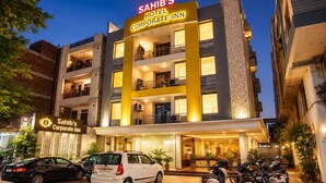 A multi-story building with a sign reading 'Sahib's Corporate Inn.' - Hotel Sahibs Corporate Inn Jaipur (Jaipur)