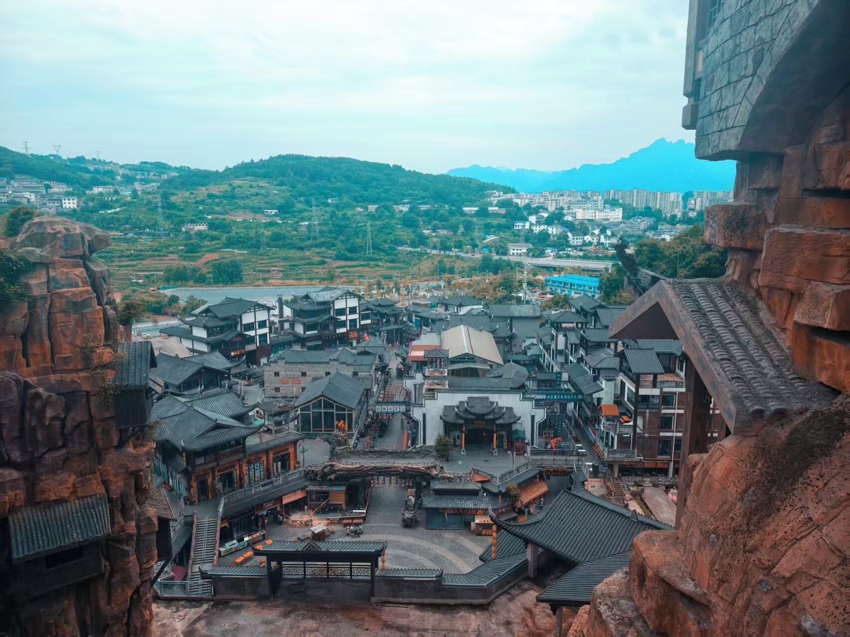 A traditional village with stone buildings and a central square.