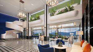 A modern hotel lobby with a spiral staircase, seating areas, and large windows offering mountain views. - Hampton by Hilton Zhangjiajie (Zhangjiajie)
