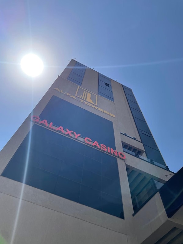 A tall building with a sign reading 'GALAXY CASINO' on its facade.