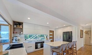 Private kitchen - Spacious Family Retreat with Pool, Waterslide & Dual Living Minutes from Beaches (Kuluin)