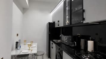 Apartamento luxo, vista para a cidade | Cozinha privada