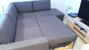 A sectional sofa with a TV stand and cable management. - 3 rooms by the Black Sea (Sonnenstrand)
