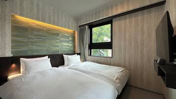 Chambre Deluxe avec lits jumeaux | Rideaux occultants, Wi-Fi gratuit, draps fournis