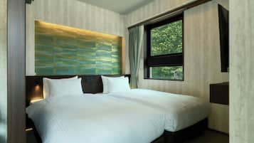 Habitación Deluxe con 2 camas individuales | Cortinas opacas, wifi gratis, ropa de cama
