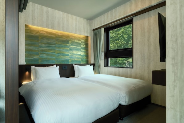 Deluxe-Zweibettzimmer | Verdunkelungsvorhänge, kostenloses WLAN, Bettwäsche