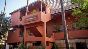 A multi-story building with a sign reading 'WONDERLAND.' - Wonderland  (Mandrem pernem)