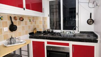 Fridge, oven, highchair, cookware/dishes/utensils
