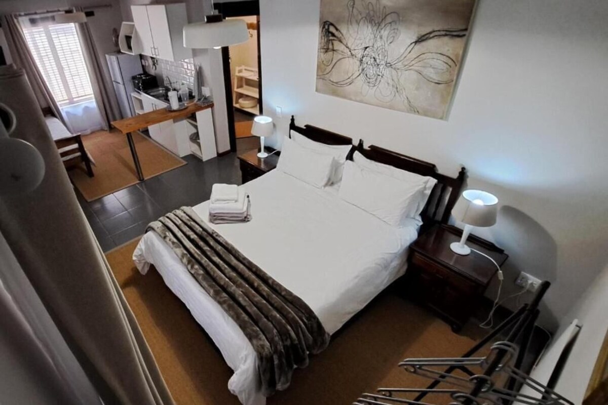Habitació doble familiar, pati, vistes al jardí | Caixa forta a l'habitació i wifi gratuïta 