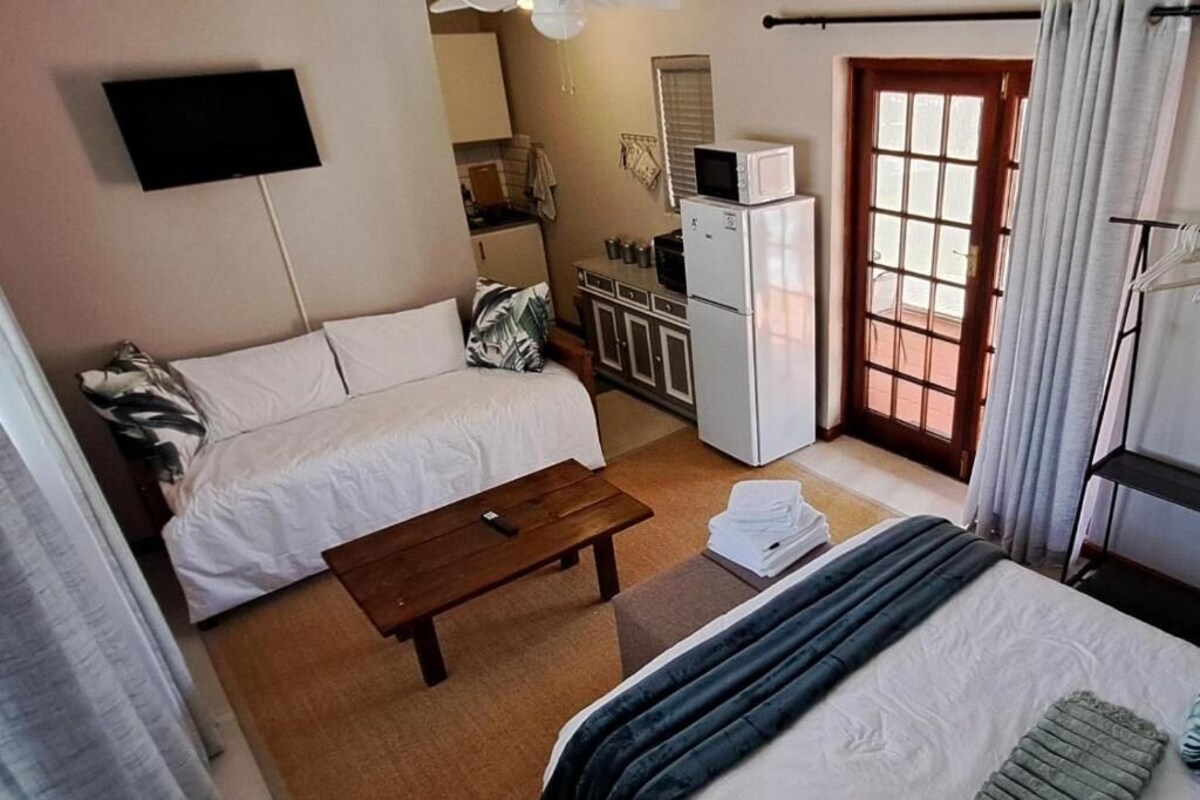 Habitació doble familiar, vistes al jardí | Caixa forta a l'habitació i wifi gratuïta 