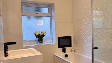 Shower, hair dryer, towels, soap