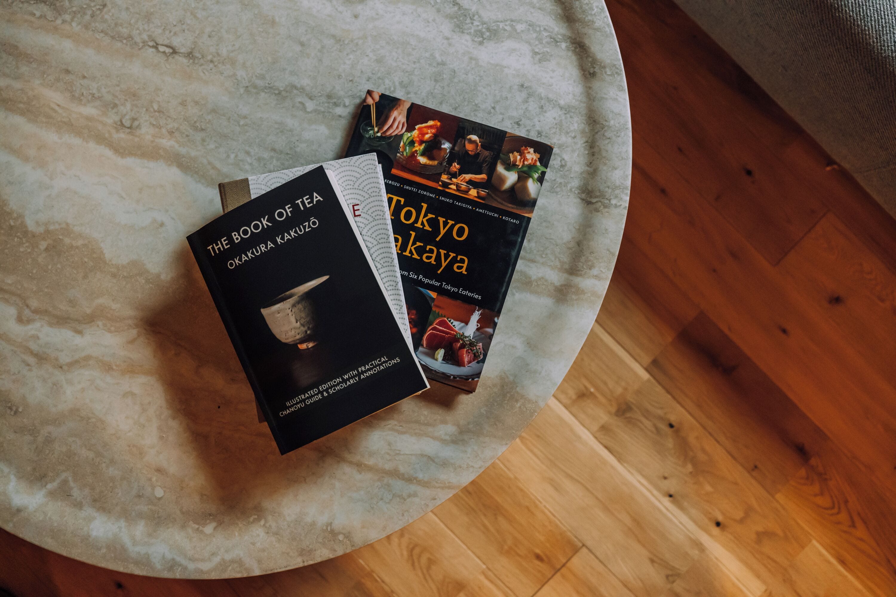 Two books on a round table.