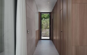 A modern hallway with a view to an outdoor area, featuring a combination of wooden paneling and tiled flooring. - Gorgeous home in Privlaka (Privlaka)