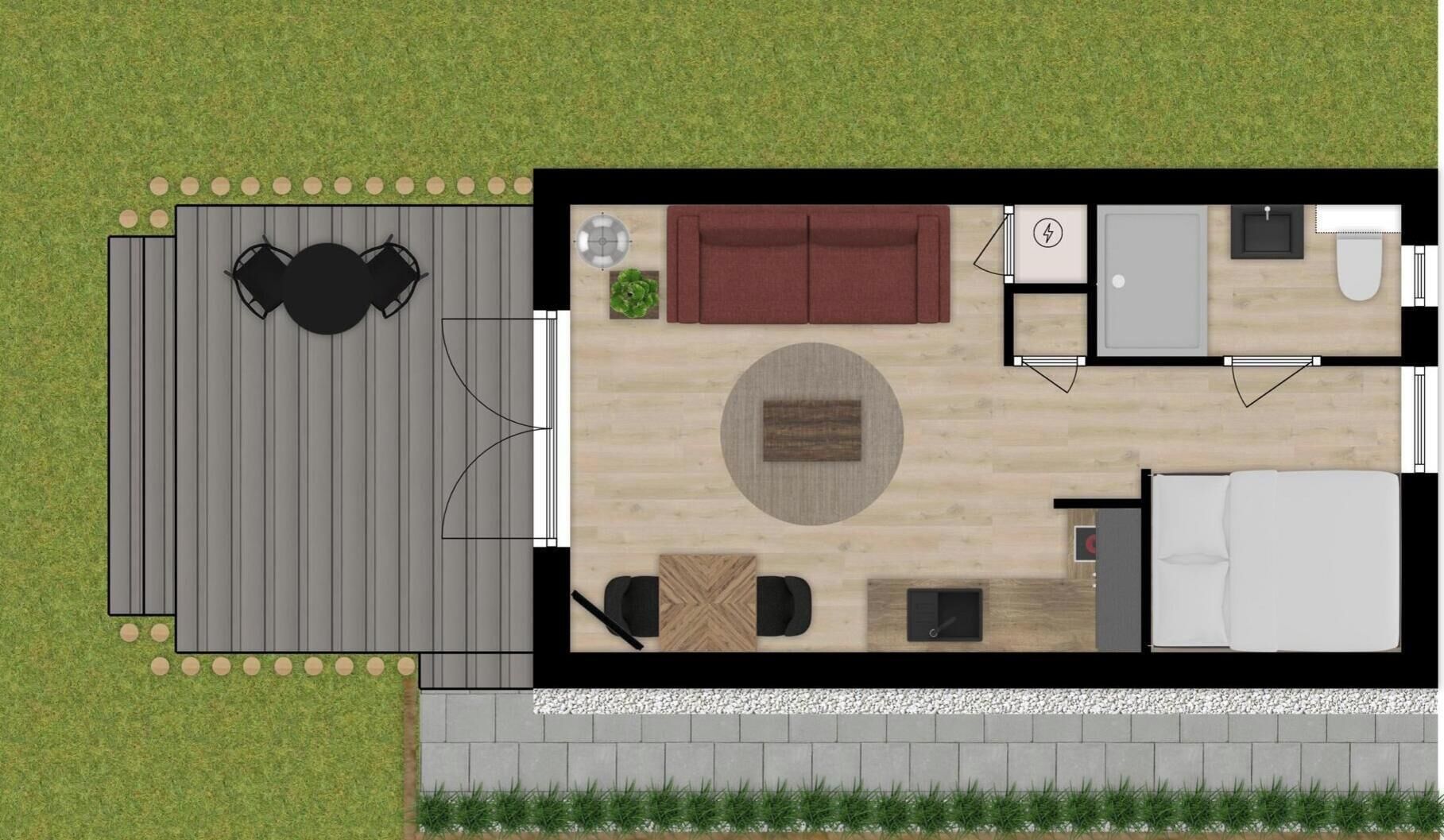 Un plan d’étage d’une chambre d’hôtel comprenant un lit, un bureau, une chaise, un canapé et une petite table.